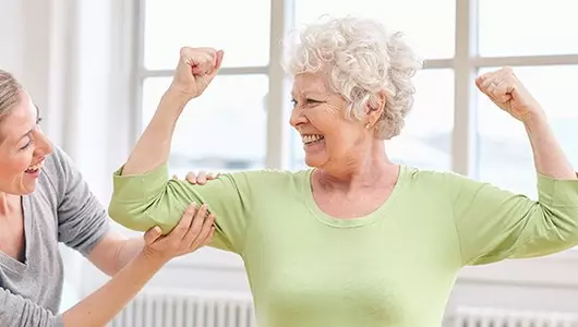older woman flexing