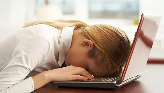 Woman feeling stressed with headache