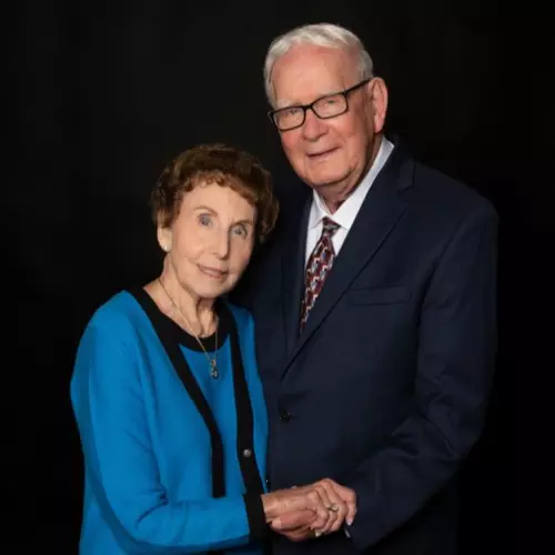 Portrait of Barbara and Herb Heili holding hands.