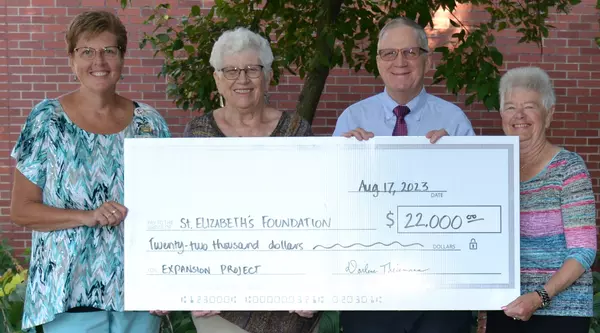 Check presentation from Gundersen St. Elizabeth's Auxiliary to foundation.