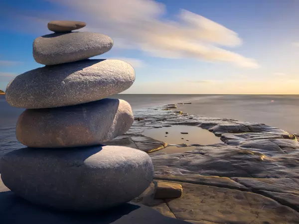 Rocks stacked near a body of water