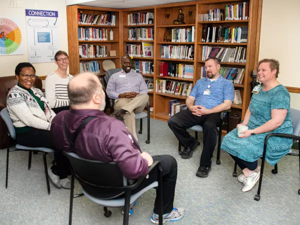 clinical-pastoral-education-team-in-circle-talking