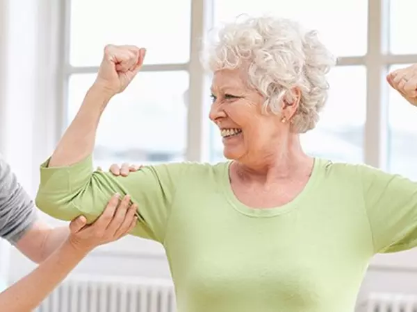 older woman flexing