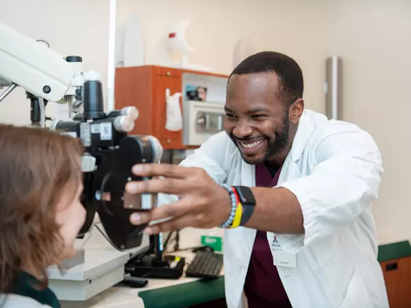 Abolade-Oduyemi-smiling-during-vision-exam