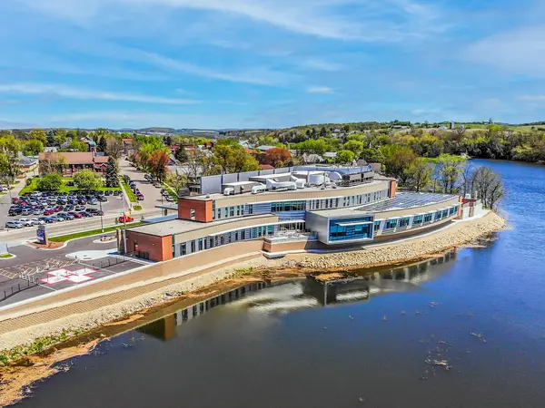 Exterior of hillsboro hospital with farms and bluffs.