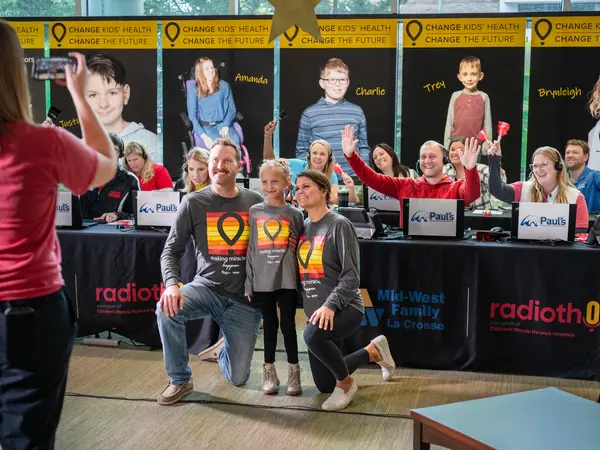 Young family taking a picture.