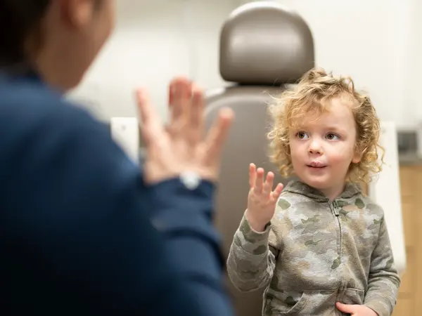 Wesley Schaller working with a speech therapist at a recent cleft clinic appointment.