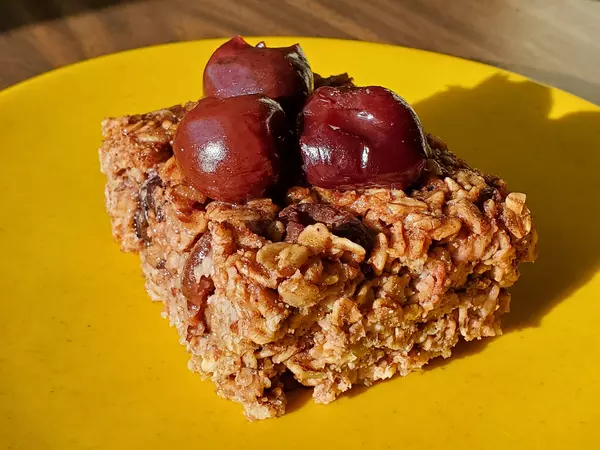 square-of-chocolate-cherry-baked-oatmeal-on-plate