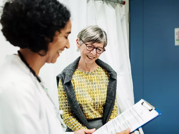Doctor Going Over Test Results With Patient