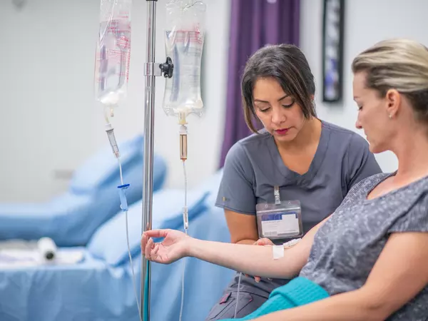 Women receives IV drip treatment