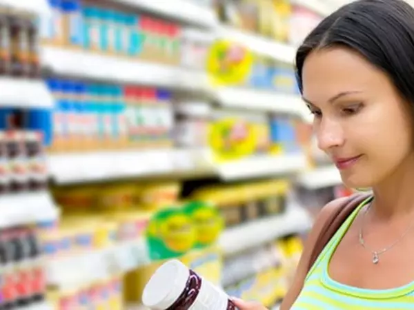 woman looking at food label