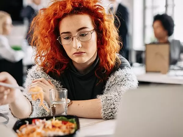 woman staring sadly at her lunch