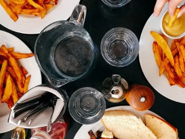 restaurant table full of plates of food