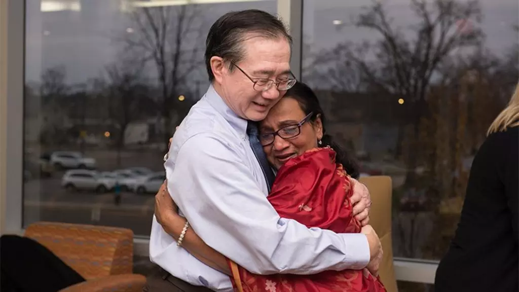 Dr. Kwong and Mrs. Ahmed hugging