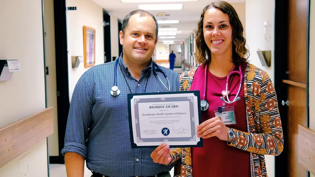 Dr. Shoskey and Andrea Anderson receive award on behalf of Gundersen St. Joseph's Hillsbor Clinic