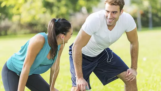man and woman resting after exercise