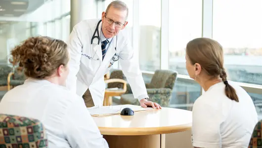 Cancer physician meeting with clinical trials at Gundersen participants.