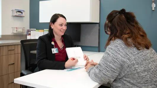 Gundersen Tri-County speech therapist working with adult patient.