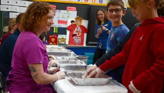 Gundersen staff visit an area elementary school to talk about the different areas of medicine through interactive stations.