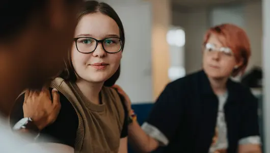 Teen girl sharing in group therapy.