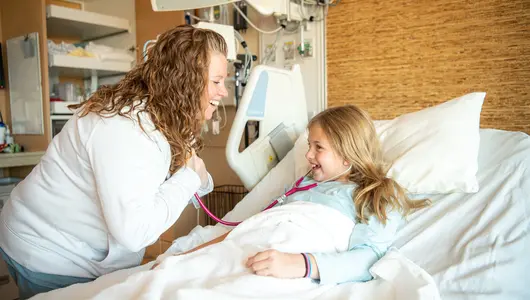 RN-laughing-with-child-in-hospital