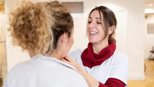 Speech therapist helping patient