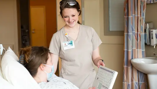 cna-caring-for-patient-in-hospital-room