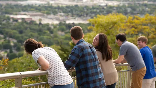 Friends sightseeing from bluff.