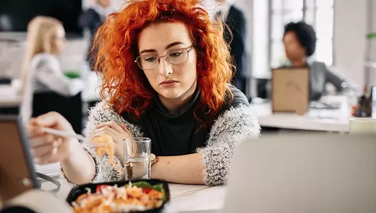 woman staring sadly at her lunch