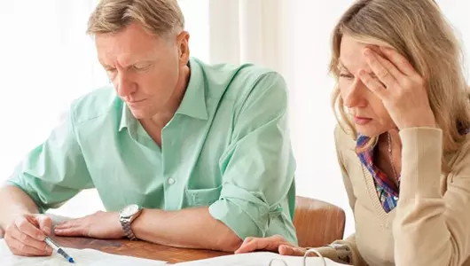 man and woman doing paperwork