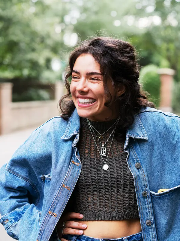 Woman laughing, with friend