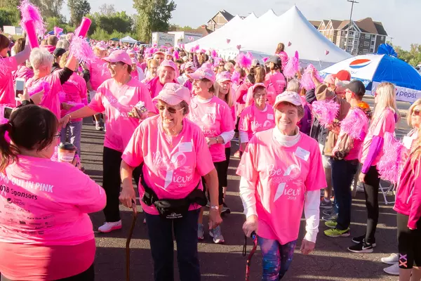 Participants walking for breast cancer awareness.