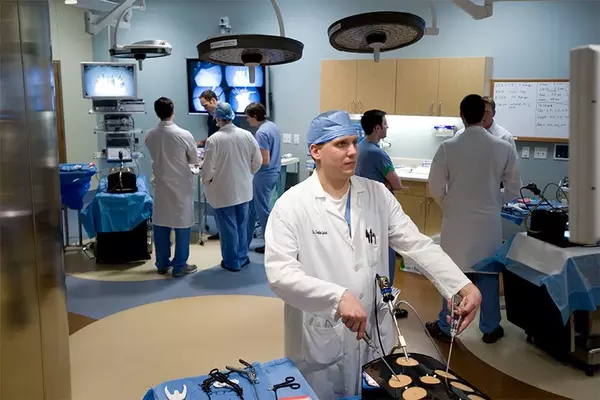 Doctors training in mock operating room.