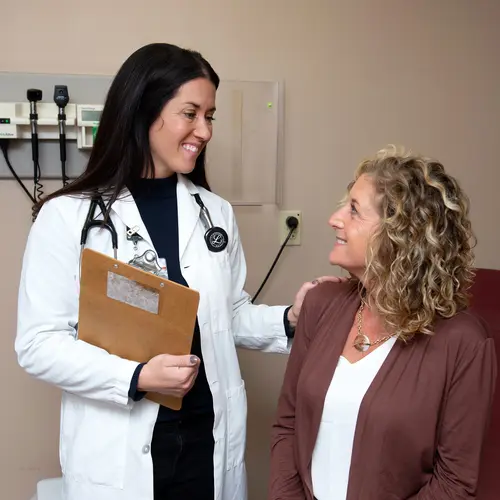 Gundersen nurse practitioner caring for patient in exam room.